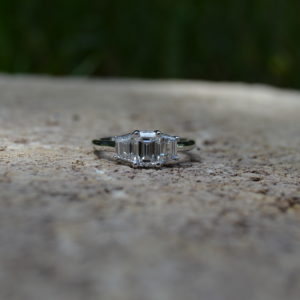 Custom designed emerald and trapezoid cut diamond ring