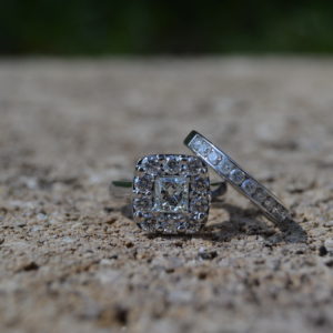 Bridal Set with princess cut diamond halo engagement ring and round diamond channel set wedding band