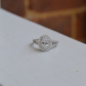 Custom designed oval diamond double halo engagement ring with diamond split shank in white gold