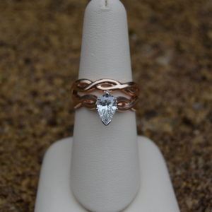 Rose gold wedding set with infinity design and pear shaped diamond
