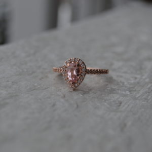 Custom designed pear shaped morganite and diamond ring