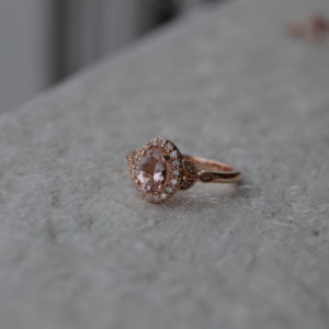 Custom designed oval morganite and diamond ring with milgrain beading in rose gold