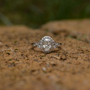 Custom Designed Oval Diamond Halo Engagement Ring with Leafy Accents