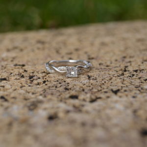 Custom Designed Engagement Ring with Twist Shank and Princess Cut Center Diamond