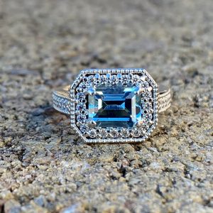 Custom Designed Emerald Cut Aquamarine and Diamond Halo Ring